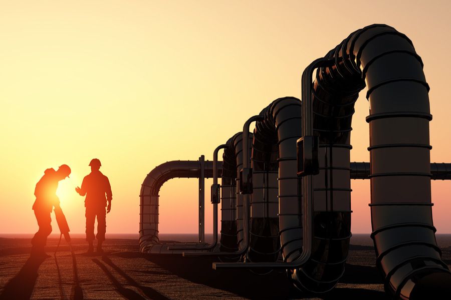 Rich Oils Group – Oil workers checking oil pump